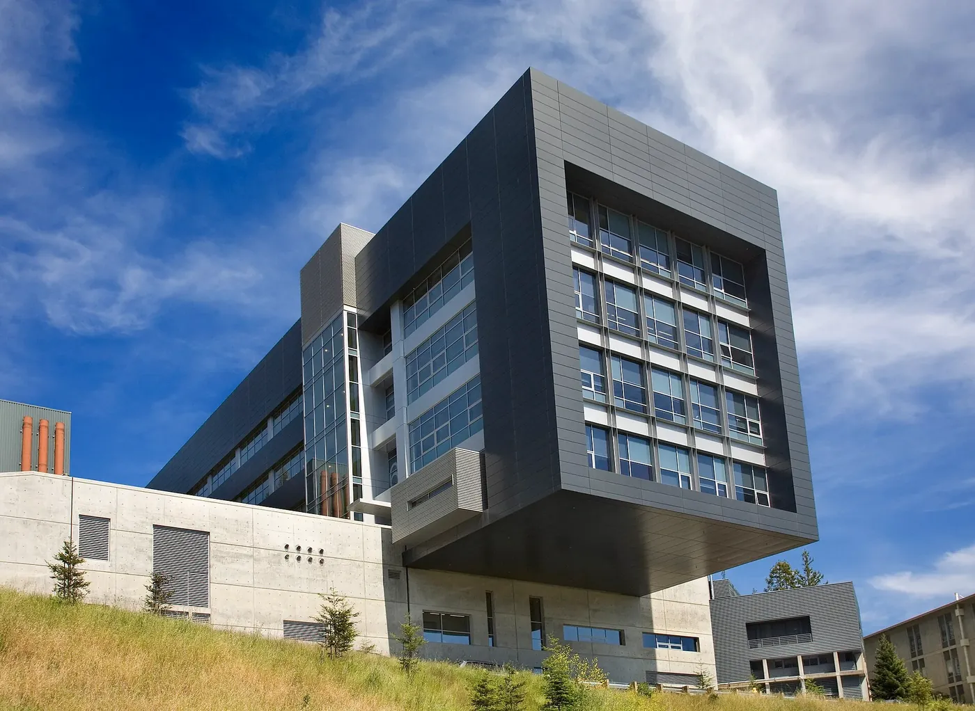 The Molecular Foundry building at Berkeley Lab, a dark cantilevered block against a blue sky